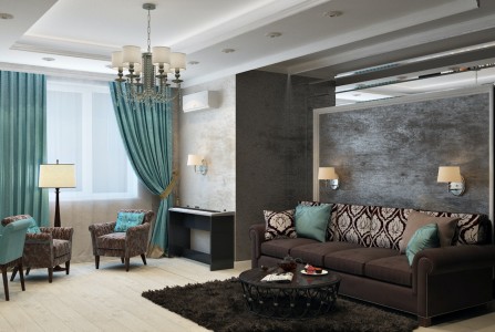 Esta imagen muestra la decoración de un salón con un sofá marrón y cortinas en tonos azul turquesa. La pared detrás del sofá también está pintada en un elegante tono marrón, creando una armonía visual en el espacio. Decoración sofisticada en tonos marrón y azul turquesa